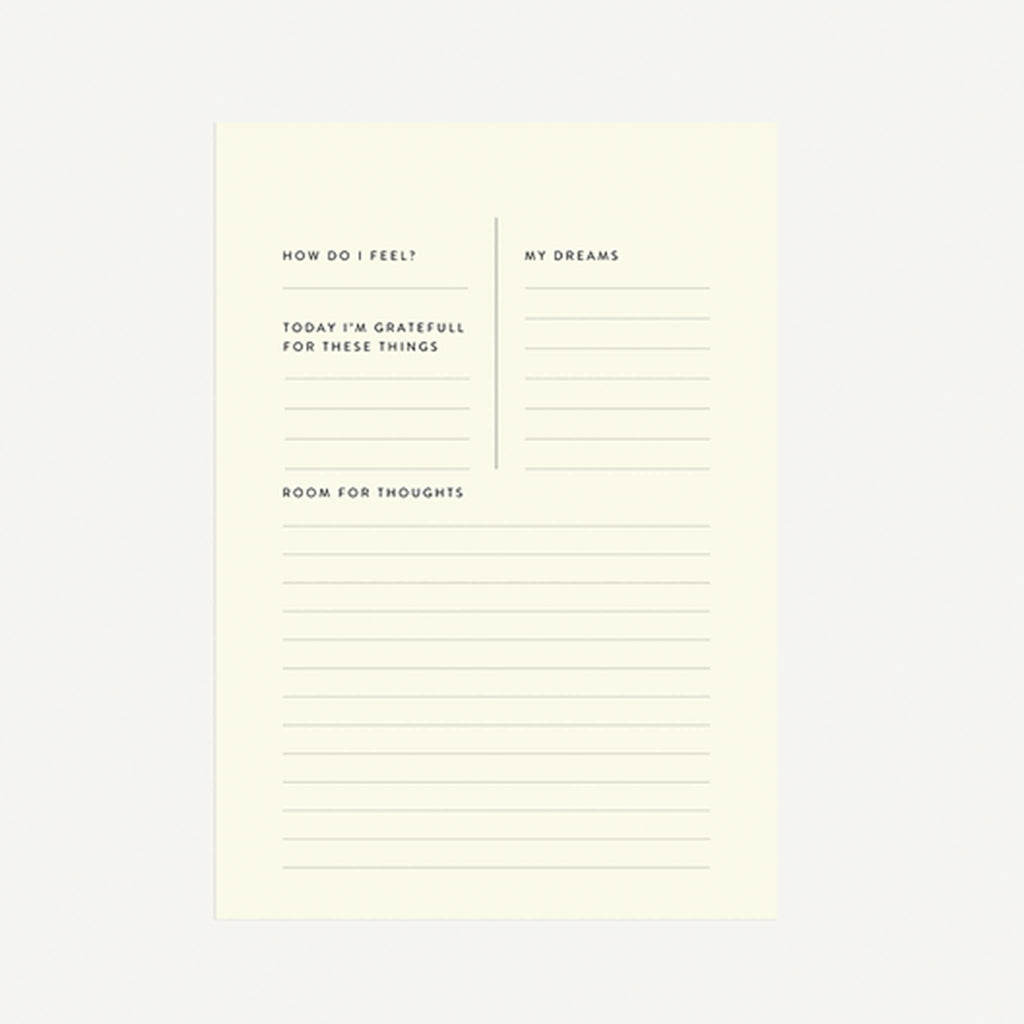 Guided notepad featuring journaling prompts and lined paper.