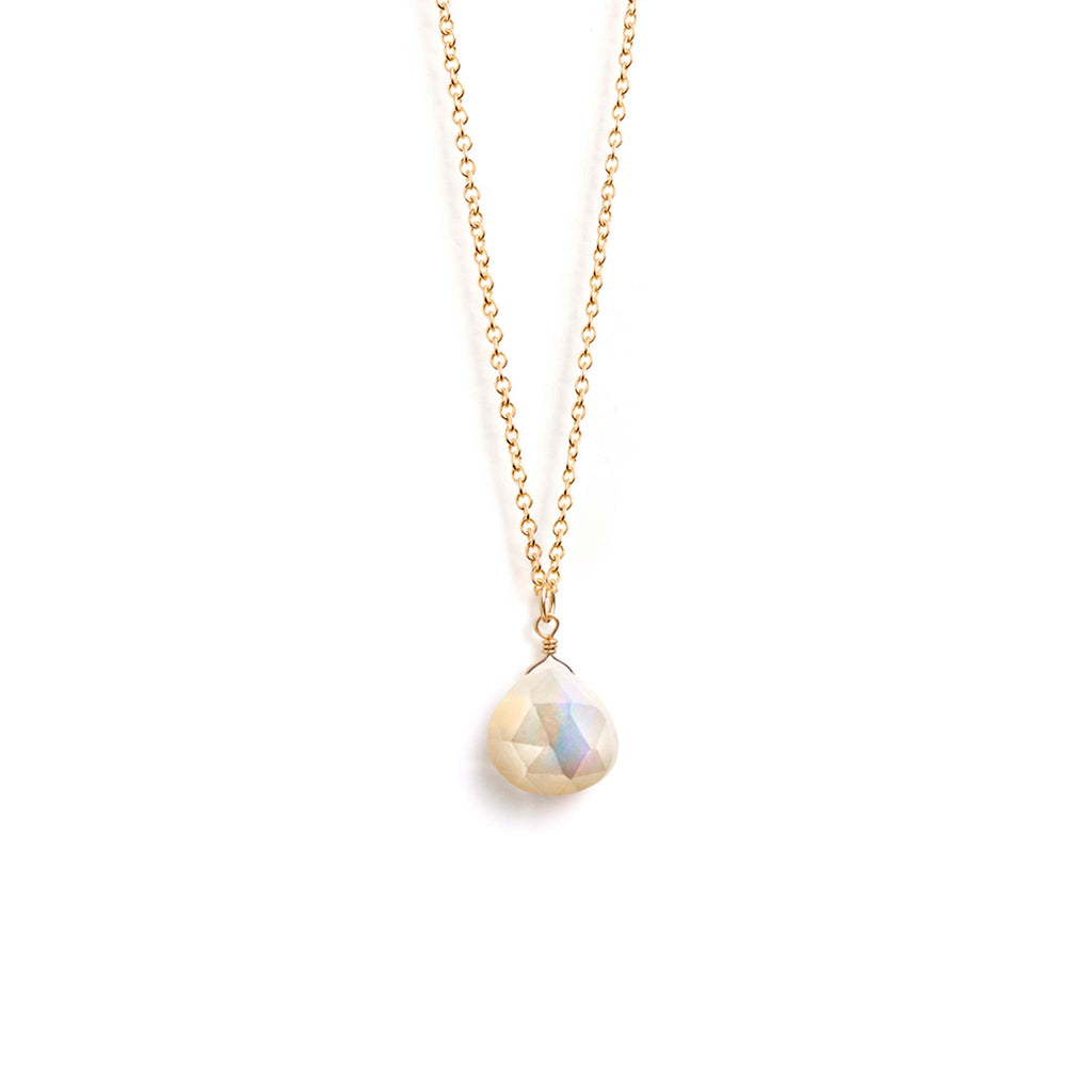 An iridescent white mother of pearl gemstone hangs from a minimal gold-fill chain. With an adjustable chain, this gemstone necklace is perfect for layering. 