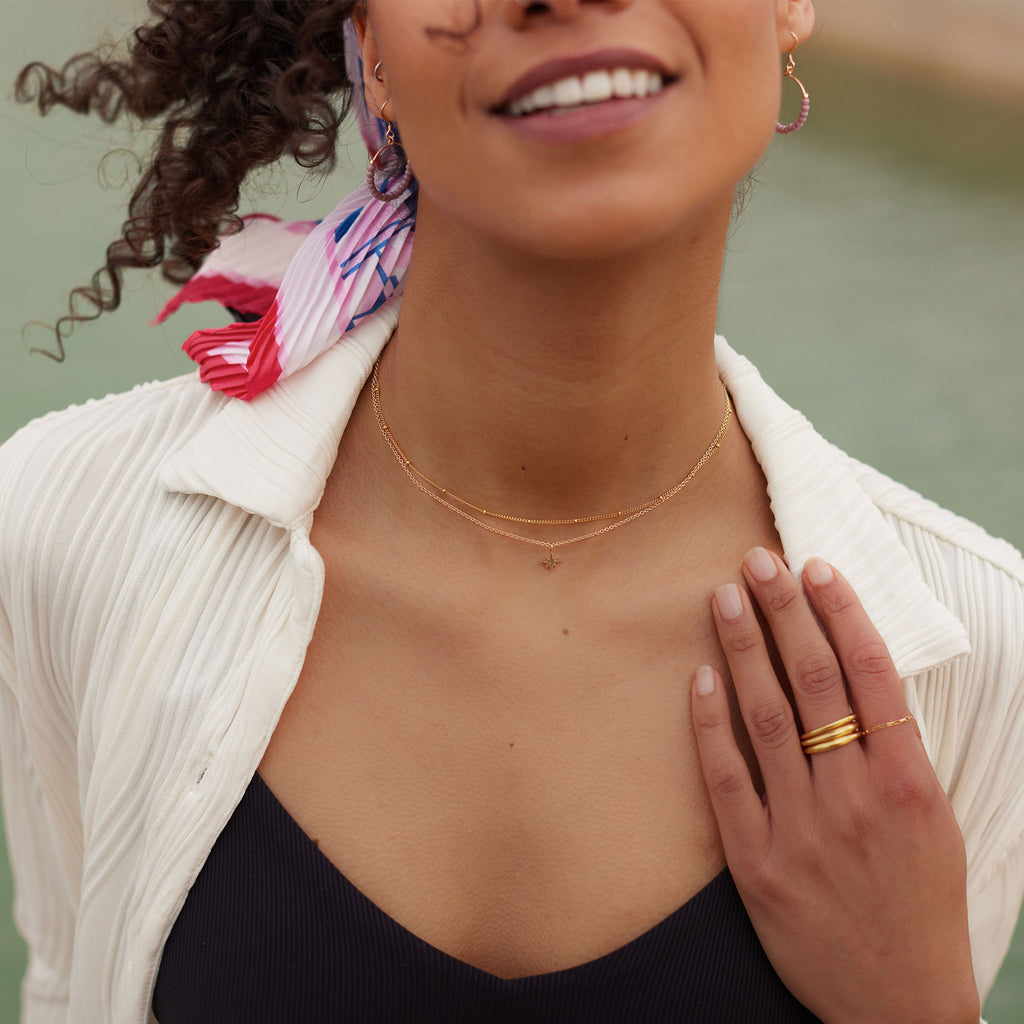 Petite Nova Star Fine Gold Chain Necklace. A delicate 14k gold fill chain necklace with a handcrafted nova star pendant. Proudly designed in Devon & handcrafted by our Wanderlust Life global artisan partners.