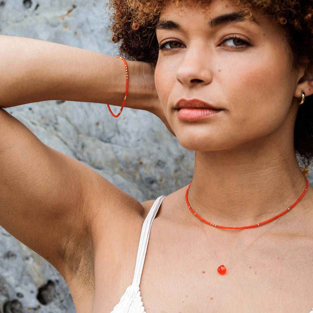 The Orange Tangiers Beaded Bracelet styled with the matching necklace and orange carnelian fine cord necklace.