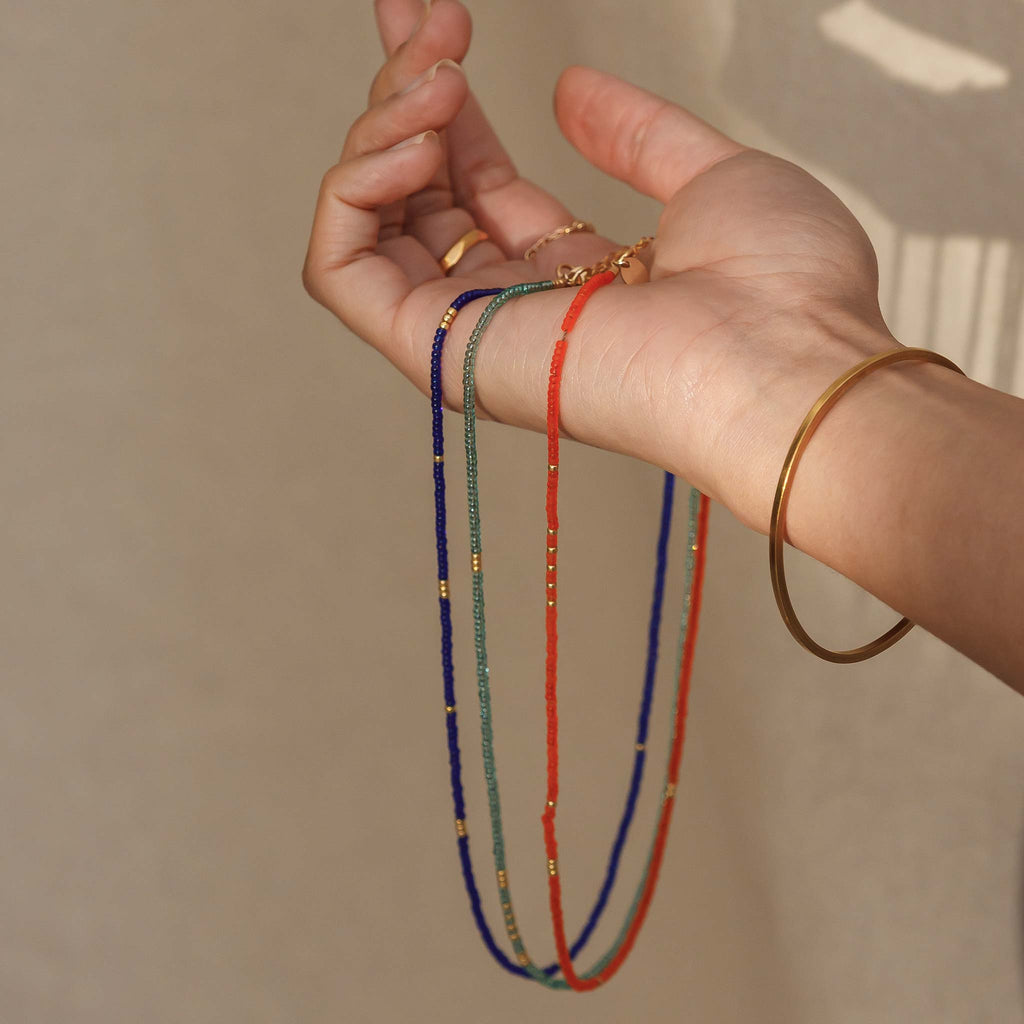 The beaded necklaces from the Ventura Collection in cobalt, Morocco blue, water blue and bright orange.