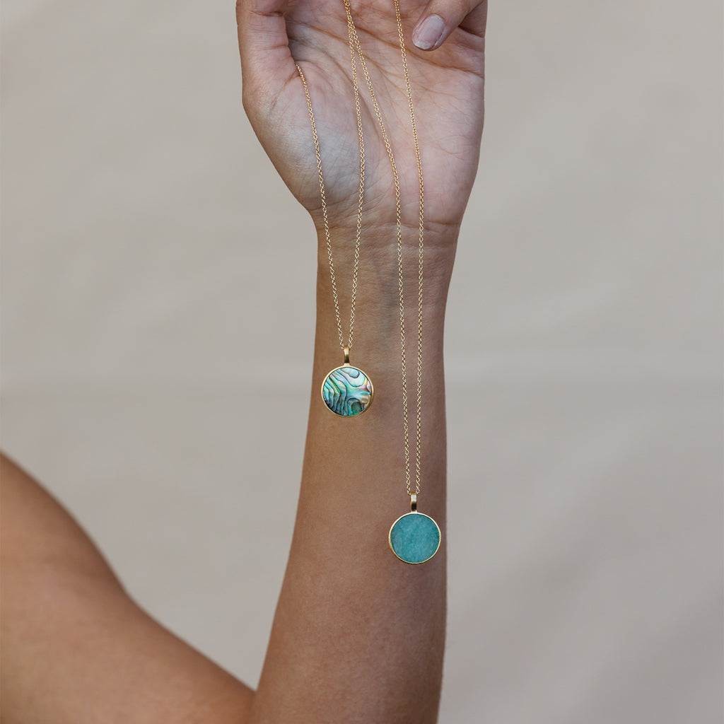 Our Ocean inspired Porthole necklaces in Paua Shell and Amazonite. The circular gemstone slices are set in a gold vermeil pendant, on minimal gold fill chains.