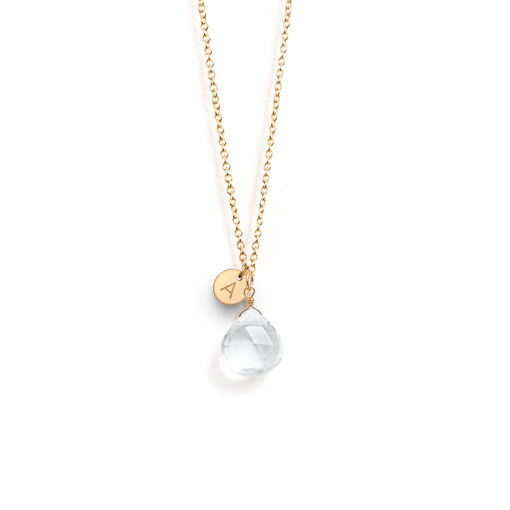 A clear quartz gemstone in our signature faceted shape floats on a minimal gold fill chain. A meaningful birthstone gift for April birthdays. Personalised with an A initial charm.