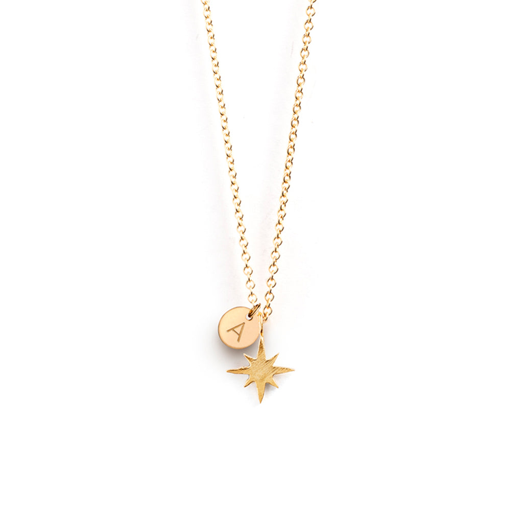 Personalised with an A initial tag, the Petite Nova Necklace features a star pendant on a minimal fine gold chain. Add your initial to create a personalised necklace.