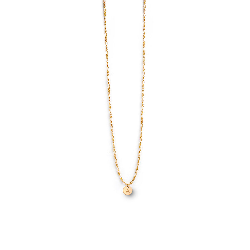 Personalised with a monogram initial tag, the Sofia Necklace is a Figaro layering chain with an adjustable length. Shop initial tag necklaces and personalised jewellery online at Wanderlust Life.