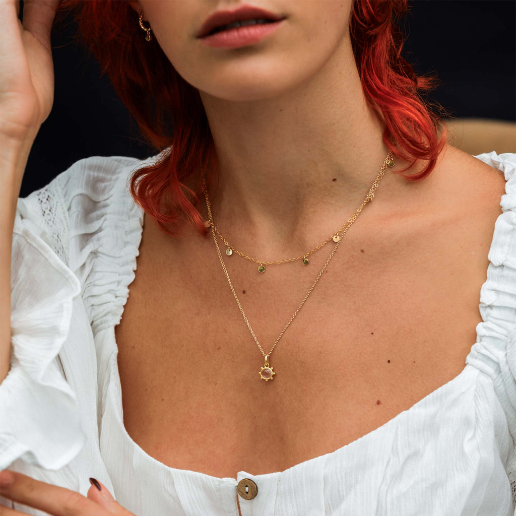 A layered necklace stack style of Quartz Ship's Wheel Necklace and best selling Telltale necklace.