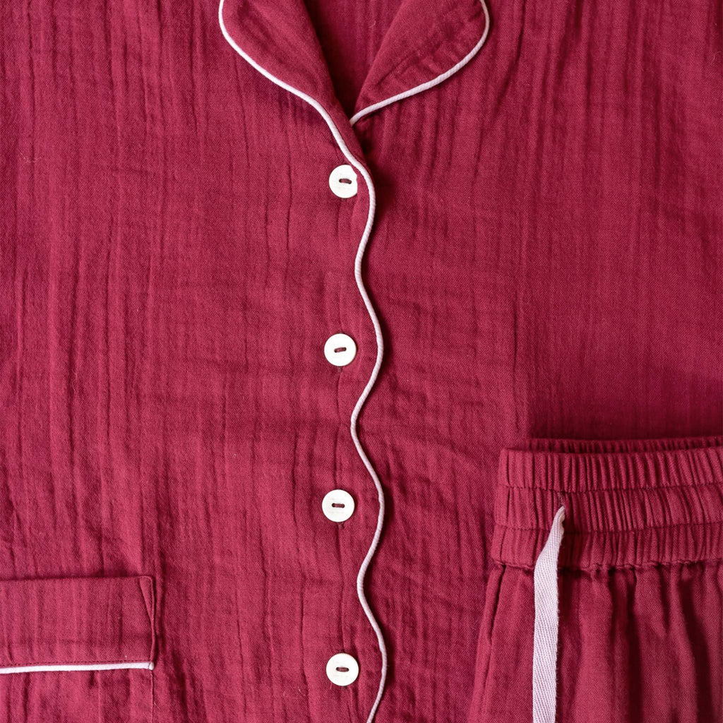 Burgundy pyjama shirt with buttons and scalloped piping detail.
