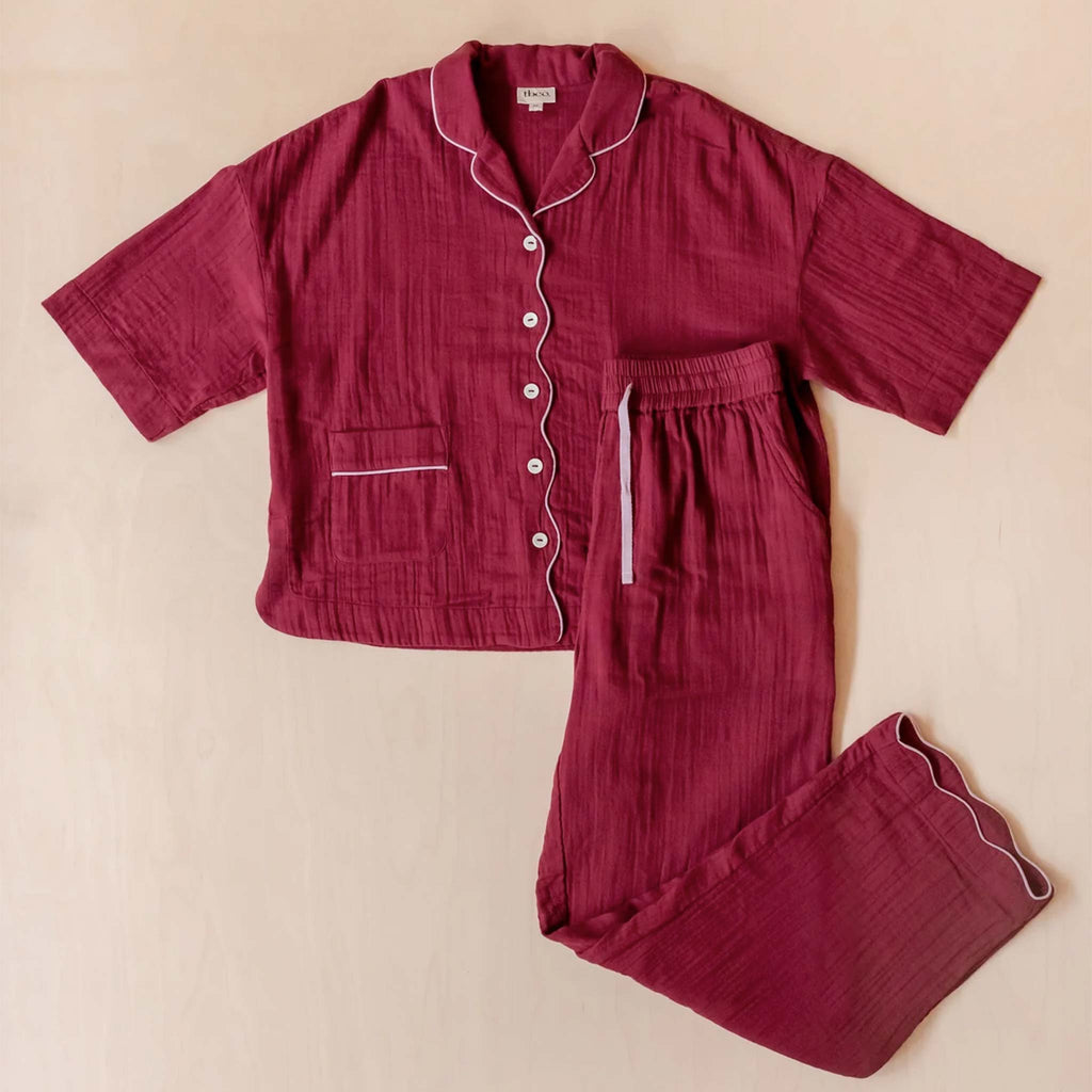 Burgundy button shirt pyjama top with elasticated waist pyjama bottoms.