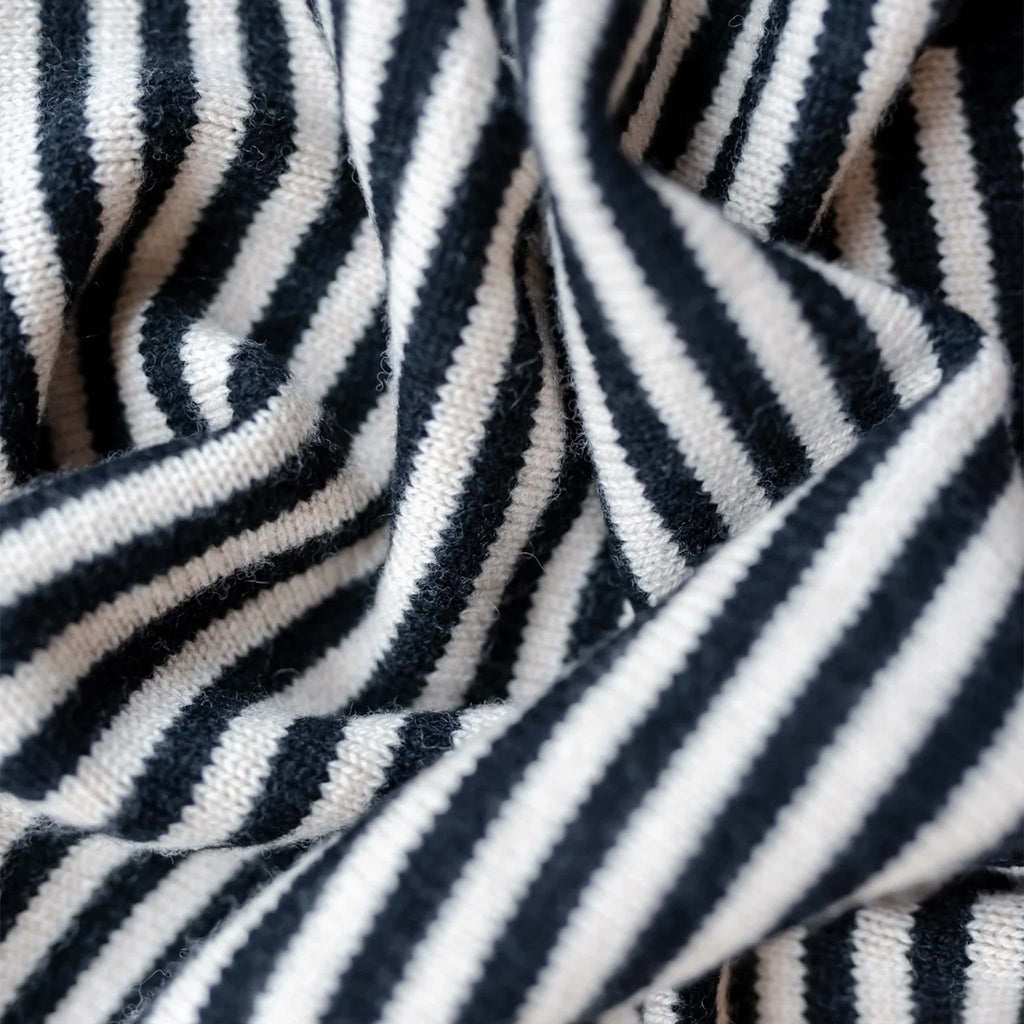 A triangle style scarf in a monochrome striped design.