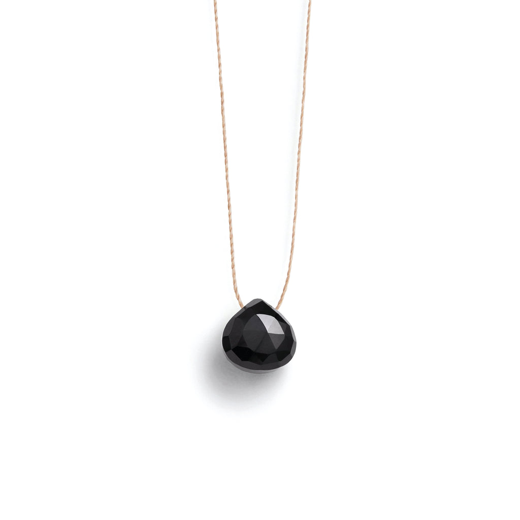 Black Spinel Fine Cord Necklace. Black Spinel gemstone in our signature faceted shape on a fine cord necklace. Proudly designed in Devon & handcrafted by our Wanderlust Life jewellery makers in the UK.