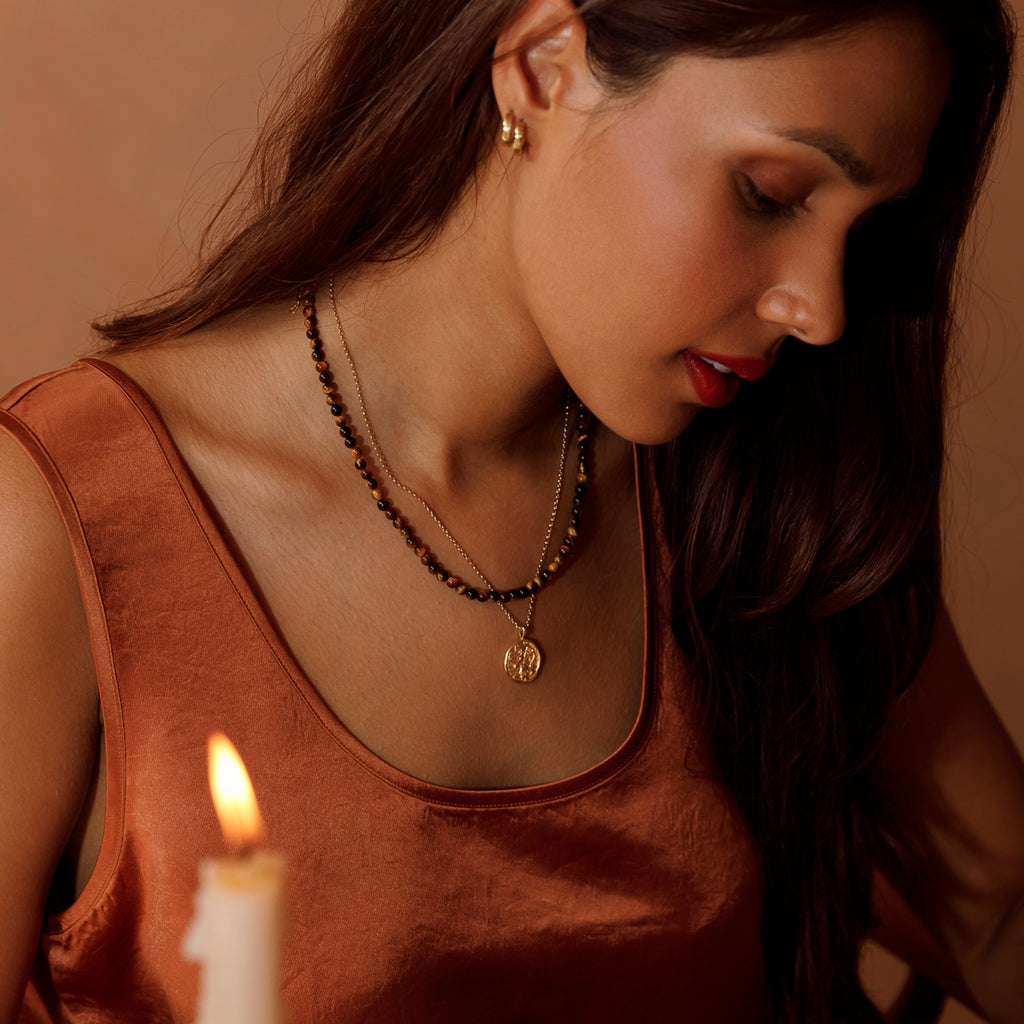 Tiger's Eye beaded necklace layered with Zodiac Coin Pendant Necklace.