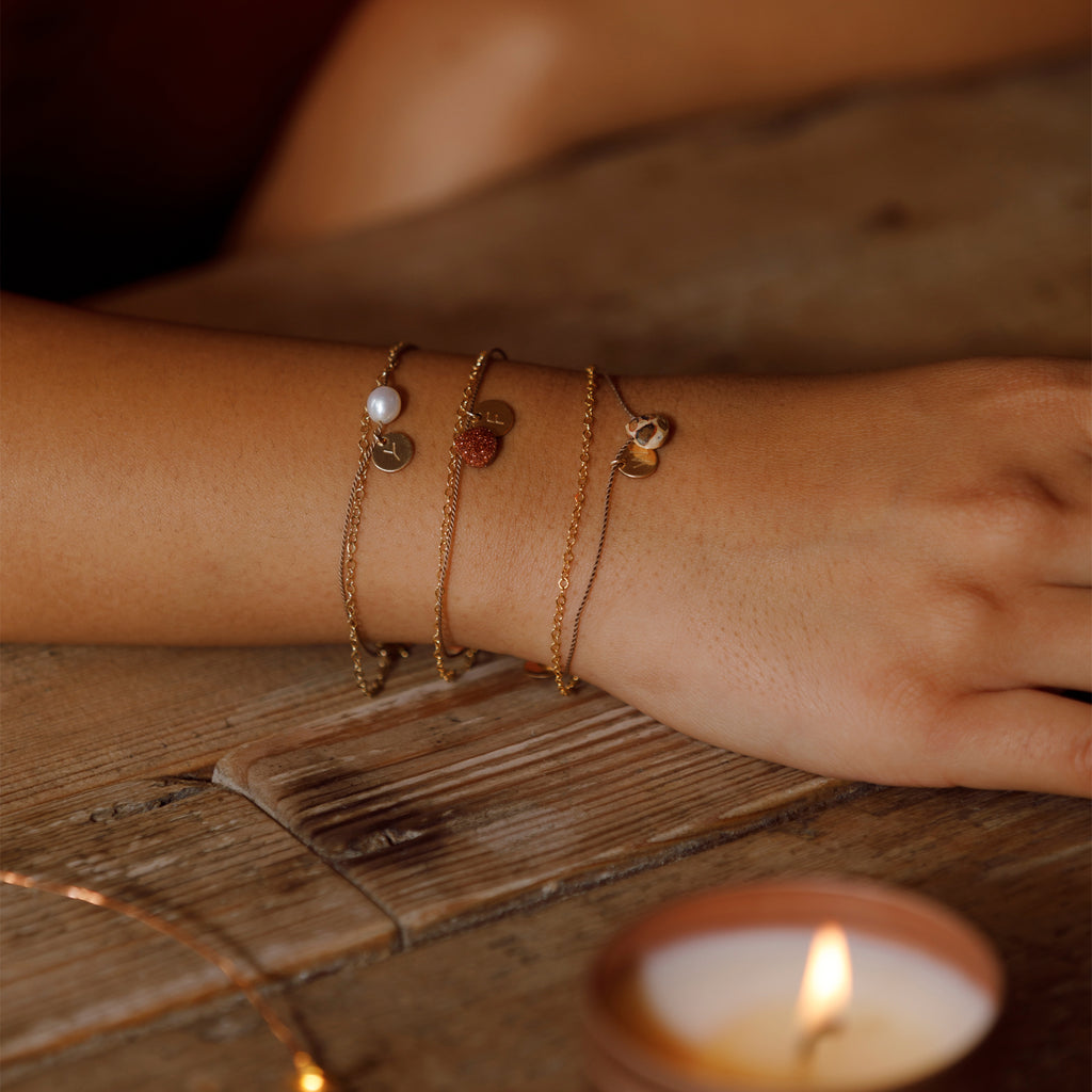 Pearl, Golstone and Leopard Jasper gold and silk bracelets. Each personalised with a hand stamped intial tag.