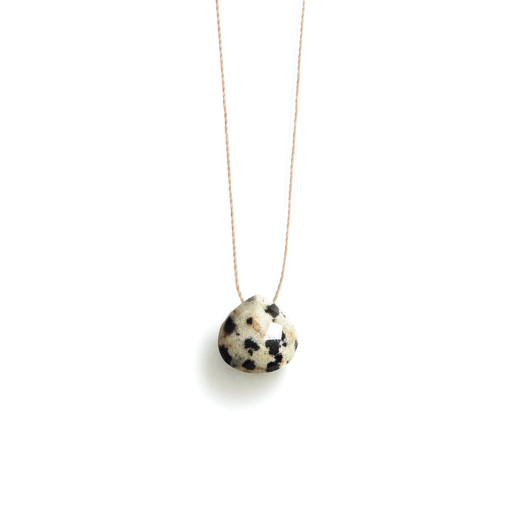 Dalmatian Jasper Fine Cord Necklace. A minimal fine cord necklace with a gemstone in our signature faceted shape. Proudly designed in Devon & handcrafted by our Wanderlust Life jewellery makers in the UK.