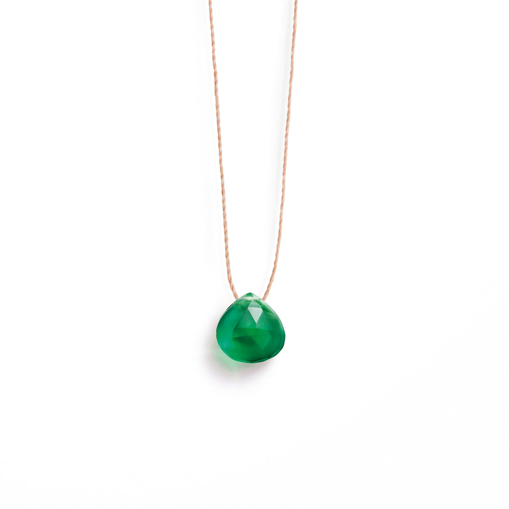 Modern & understated, a solo green onyx gemstone in our signature faceted shape slides on a delicate & minimalist fine cord necklace. A piece charged with an effortless, up-for-anything spirit. Wanderlust Life fine cord necklace is handmade, unique jewellery made in our UK store and studio.