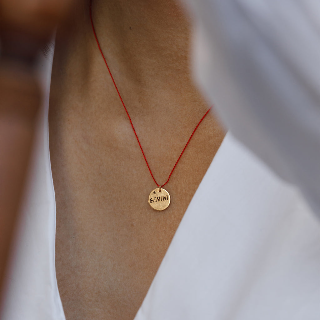 A striking twist on our signature fine cord necklaces, this bold red edition features a beautifully engraved zodiac name and star.
