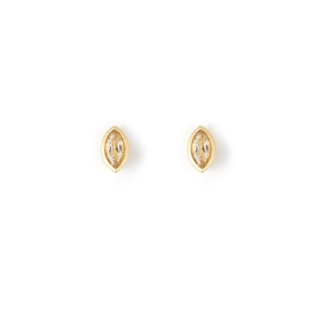 A delicate elliptical bezel setting surrounds a shimmering White Topaz on a stud earring.