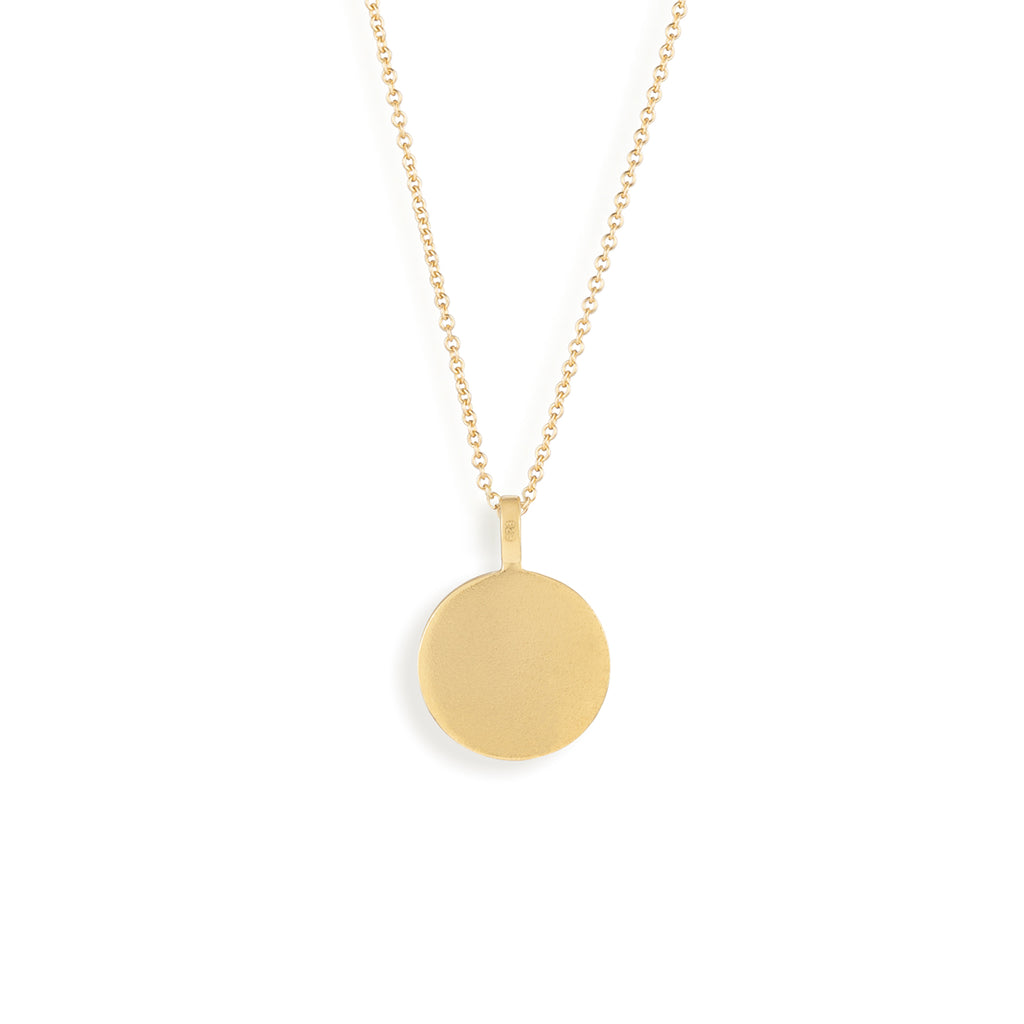 The reverse side of the Porthole Necklace in a brushed gold vermeil finish. The reverse can be personalised with free engraving.