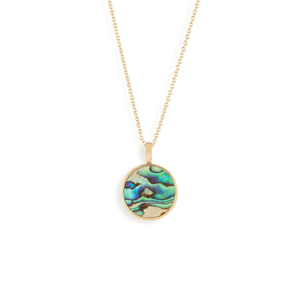 A circular pendant reminiscent of a porthole featuring a slice of Paua Shell. Each Paua Shell necklace has a totally unique texture and pattern, with iridescent hues of green, blue and black.