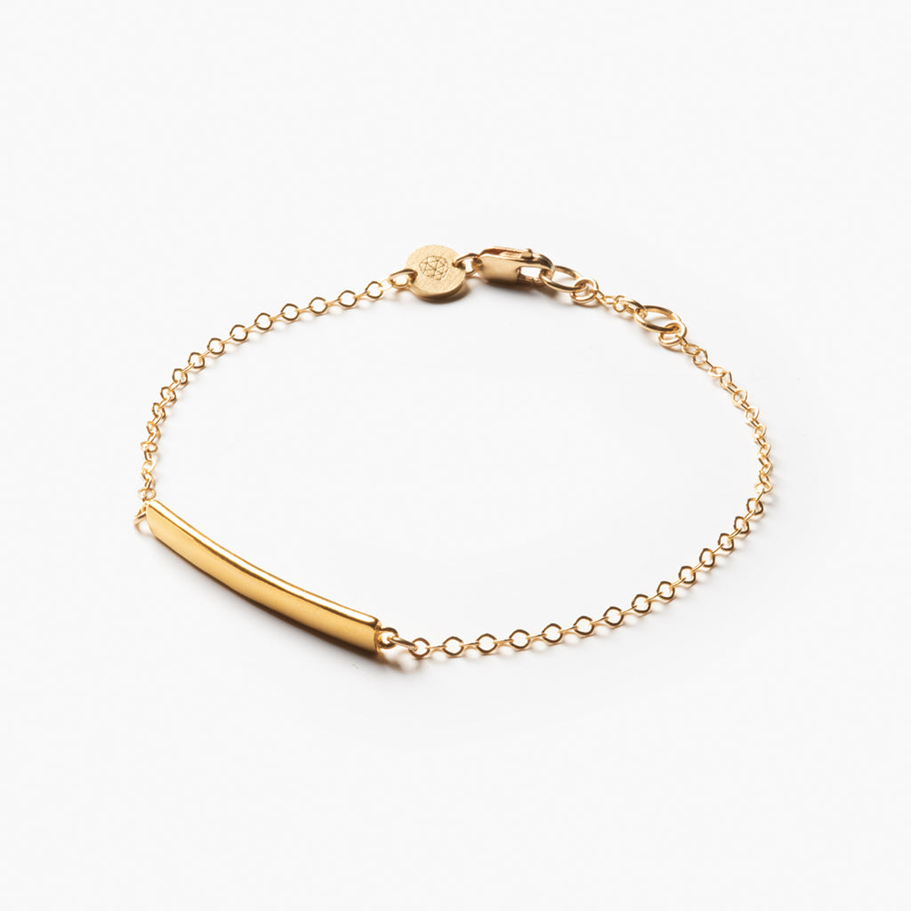 Maxime Bar Bracelet. Engravable bracelet, a slim bar rests on the wrist between two lengths of fine chain. Wanderlust Life jewellery, proudly designed and handcrafted in our Devon studio.