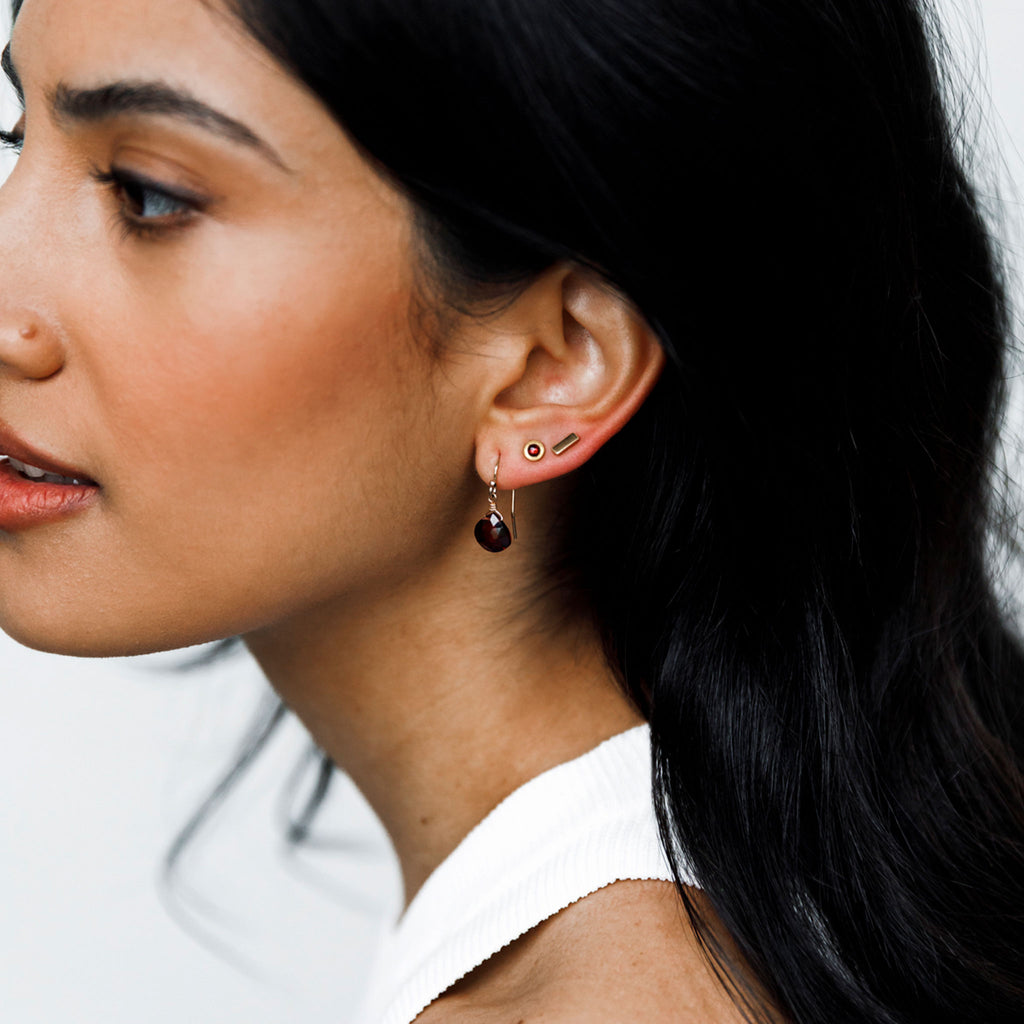 Striking January birthstone earrings, each featuring a solitary semi-faceted gemstone suspended from a gold filled ear wire. A meaningful birthstone gift for January birthdays or a perfect addition to your own jewellery collection.