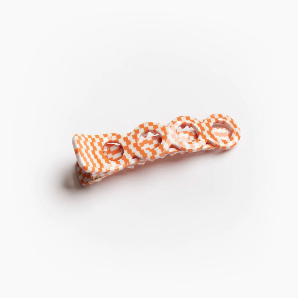 Citrus inspired alligator hair clip in a checker pattern with contrasting white and orange. Hair accessory for styling hair everyday. Designed in LA, California by Winona Irene.