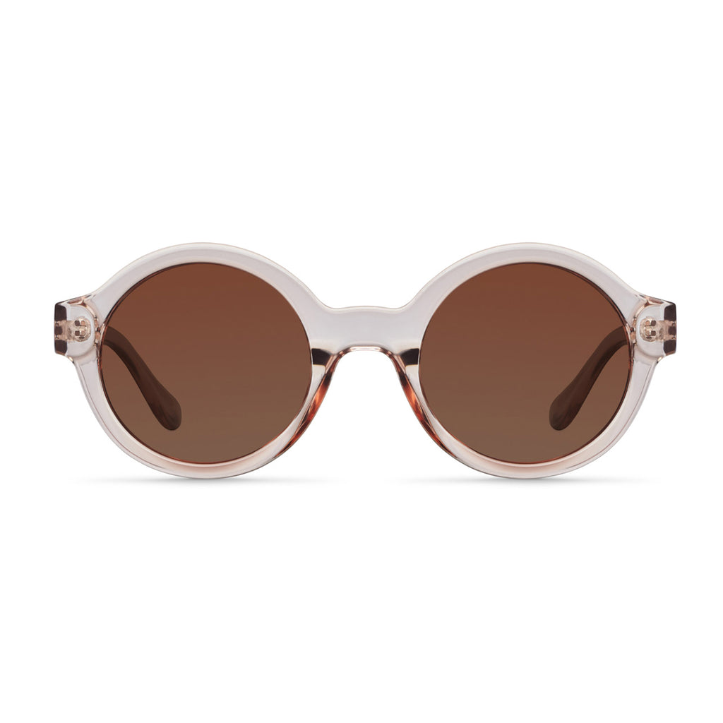 The Meller Bashira Salt Kakao Sunglasses are a 1920's shape with a contemporary circle frame and provide total protection against UV rays.  Meller sunglasses maintain the vision of natural colours, superior sharpness and contrast with glare-free vision. 