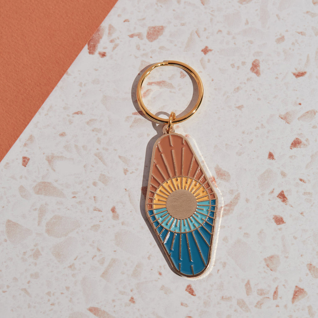 Eye-catching colourful sun and sea enamel key chain by Cai & Jo. Shop the Cai & Jo collection at Wanderlust Life. 