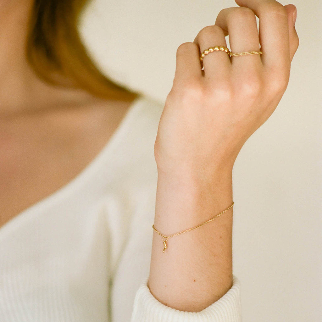 Bobbi Gold Ring, a 14 carat gold plated silver ring made up of uniform bubbles to create a rhythmic, tactile texture. Proudly designed in Devon & handcrafted by our Wanderlust Life jewellery makers in the UK.