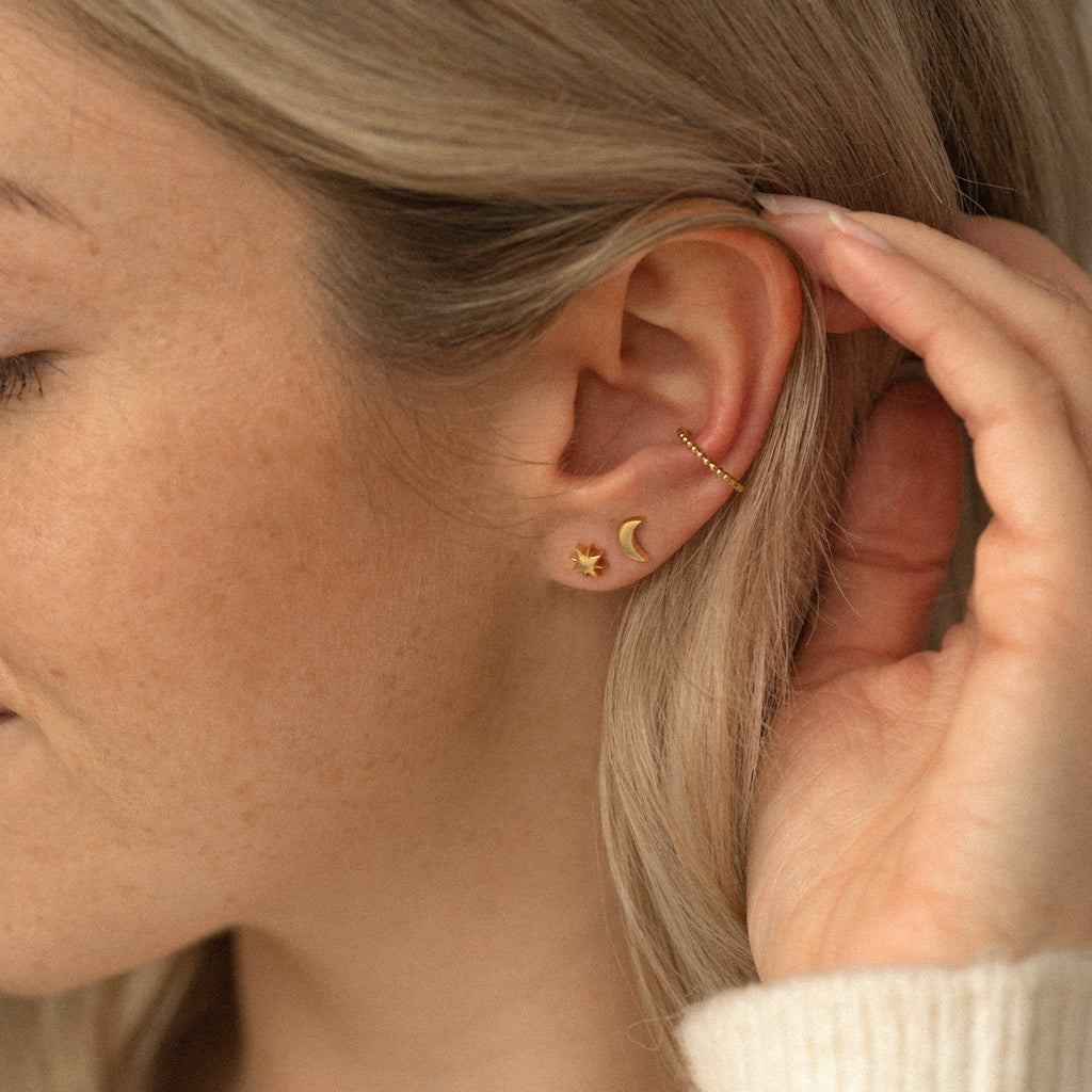 A delicate individual, handcrafted gold crescent moon stud earring. The minimalist style provides a perfect standalone statement or an easygoing companion for other pieces in your ear stack. Proudly designed in Devon & handcrafted by our Wanderlust Life global artisan partners.