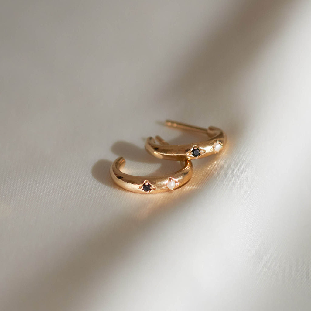 14k gold vermeil hoops featuring pearl and black spinel gemstones. Proudly designed in Devon and crafted by our Wanderlust Life global artisan partners